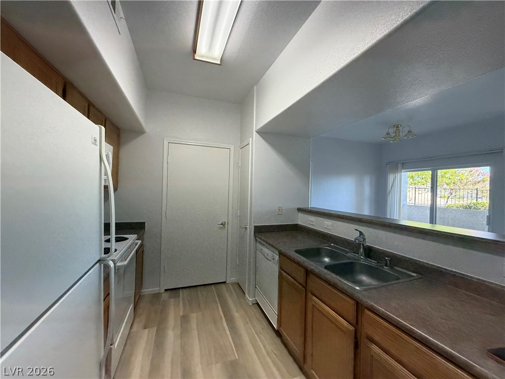 7255 West Sunset Road, Unit 1158 Las Vegas, NV 89113 - Photo 3 of 10 A well-appointed kitchen featuring a functional layout and durable countertops.
