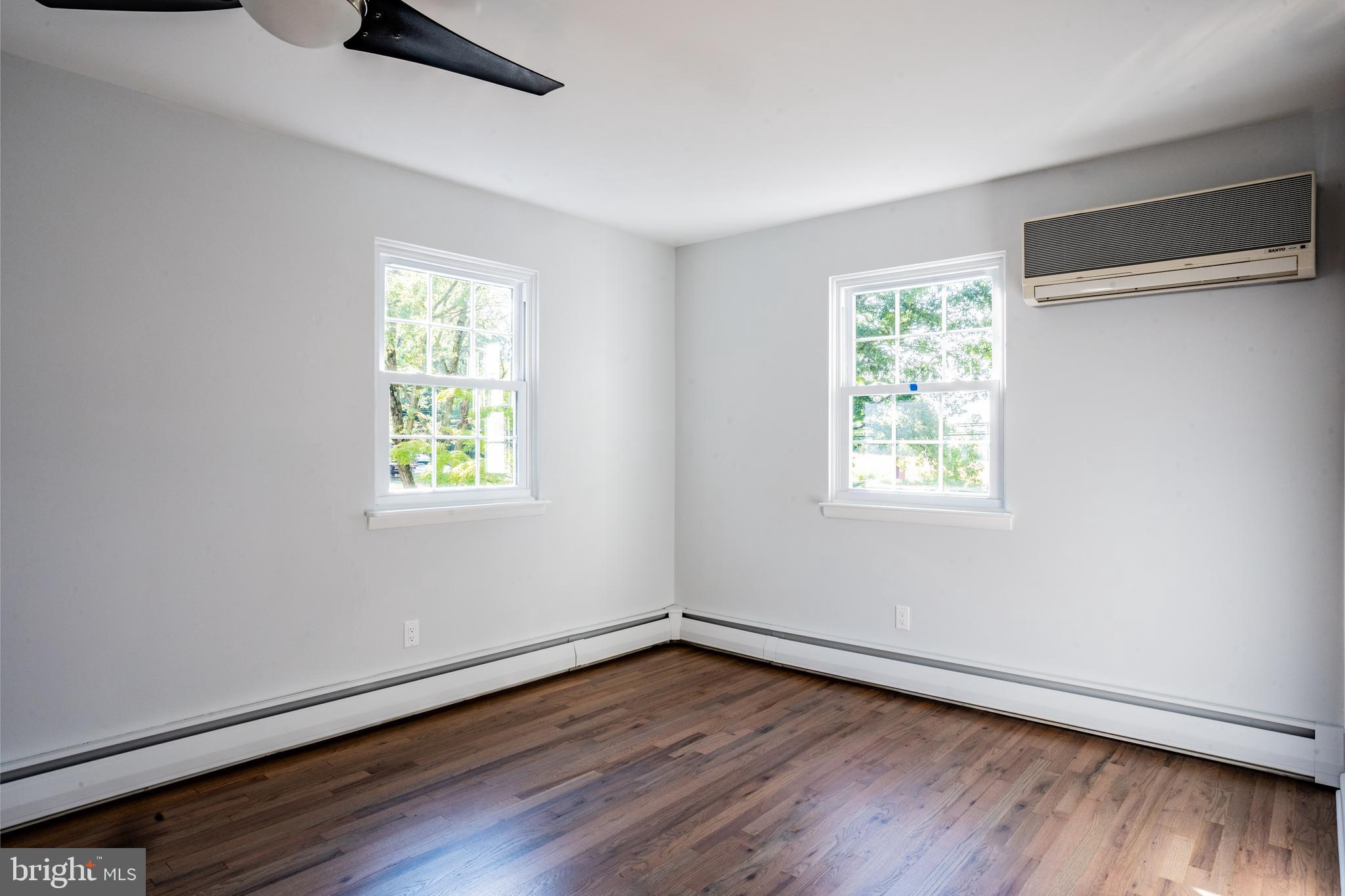 1428 Valley Forge Road Norristown, PA 19403 - Photo 13 of 24 wooden floor in an empty room with a window