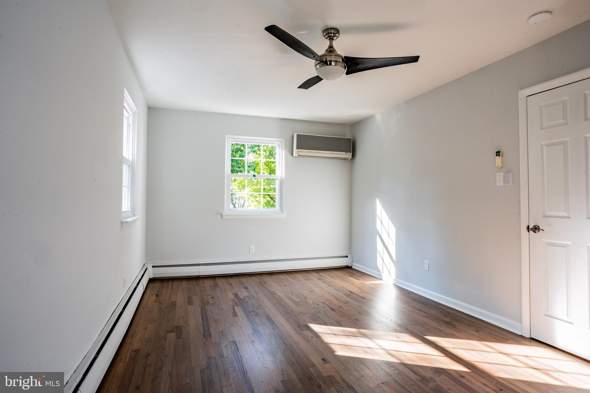 1428 Valley Forge Road Norristown, PA 19403 - Photo 14 of 24 an empty room with wooden floor and windows