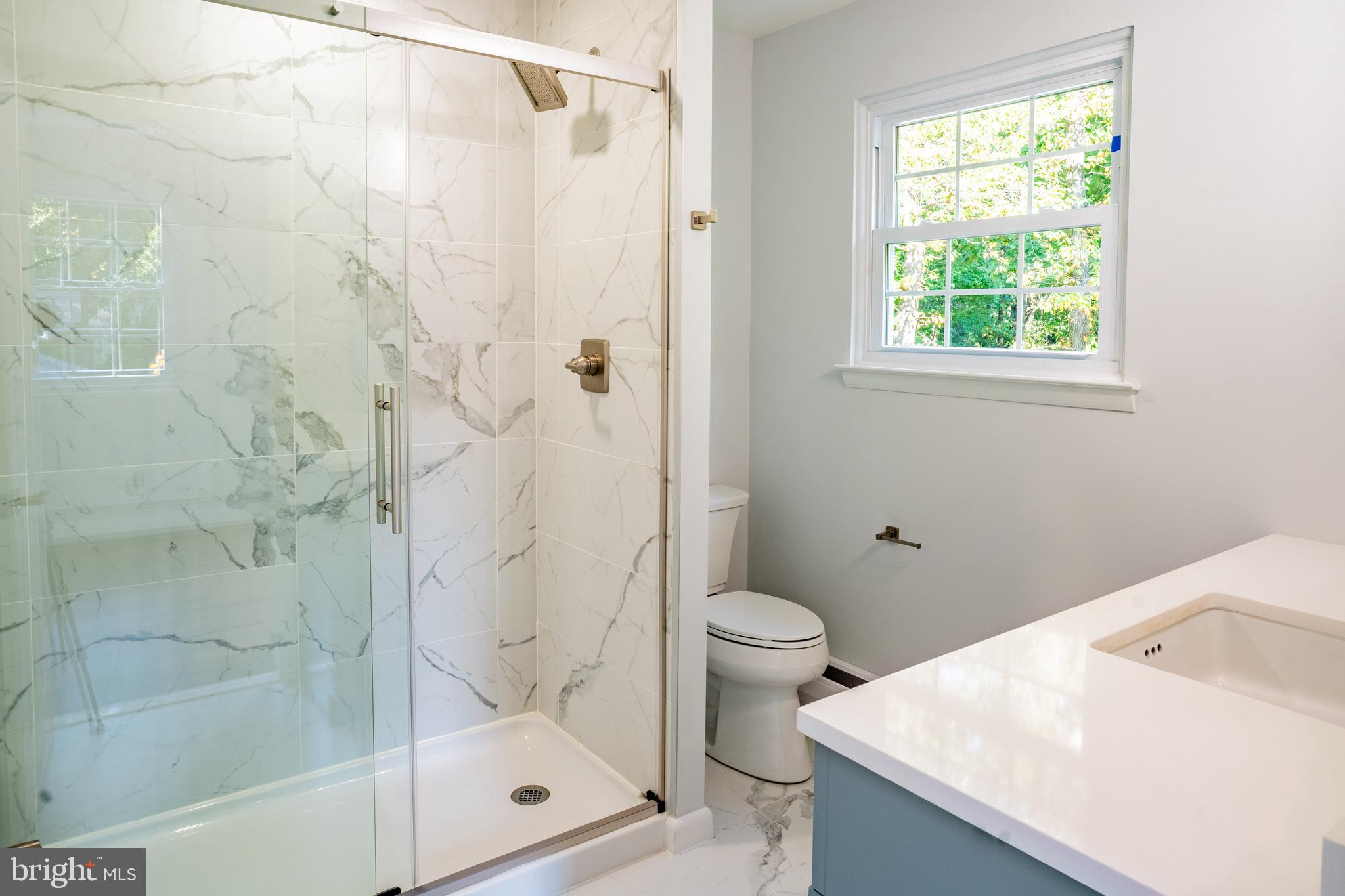 1428 Valley Forge Road Norristown, PA 19403 - Photo 16 of 24 a bathroom with a shower a toilet and a sink