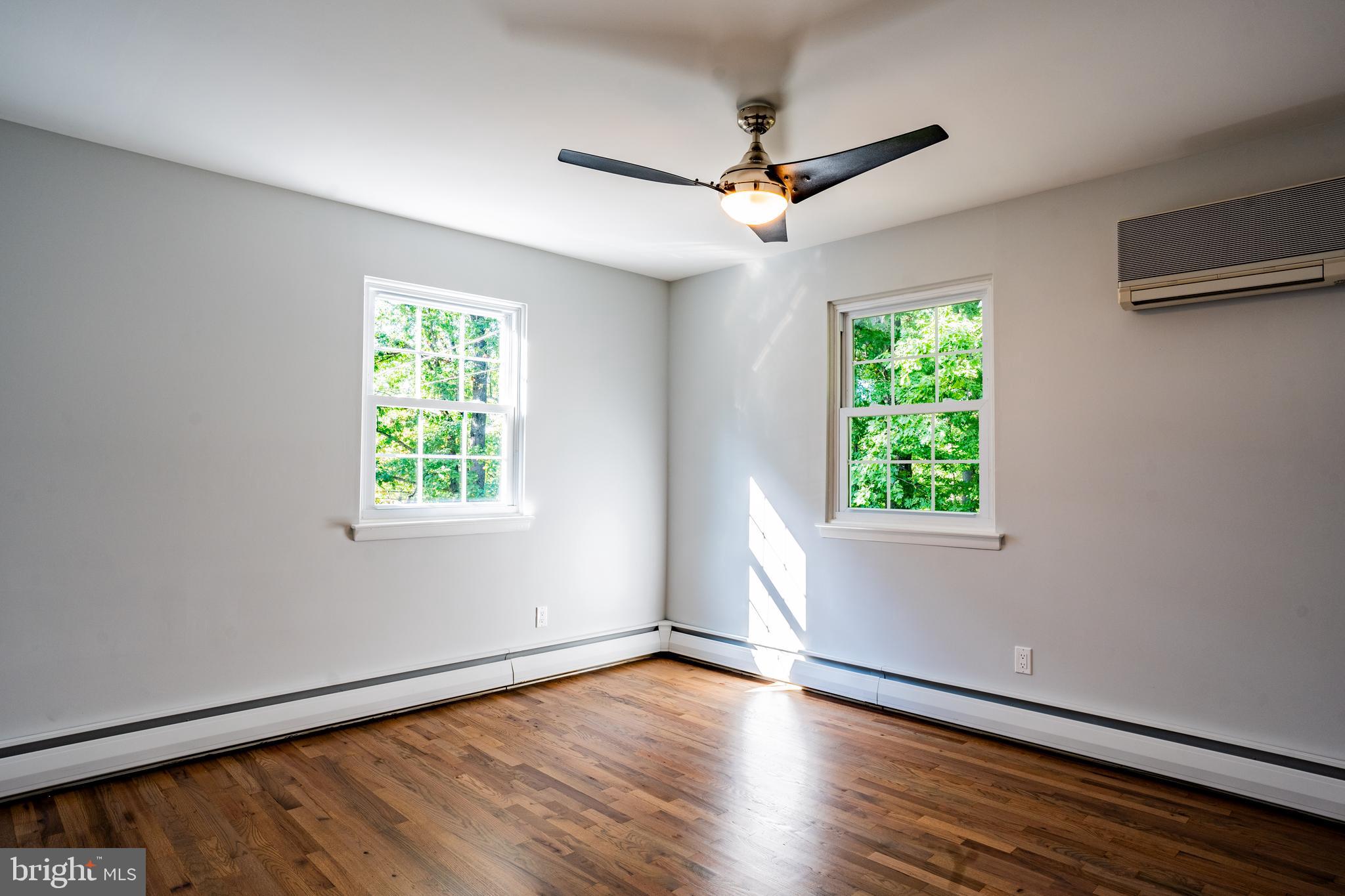 1428 Valley Forge Road Norristown, PA 19403 - Photo 18 of 24 a view of an empty room with wooden floor and a window