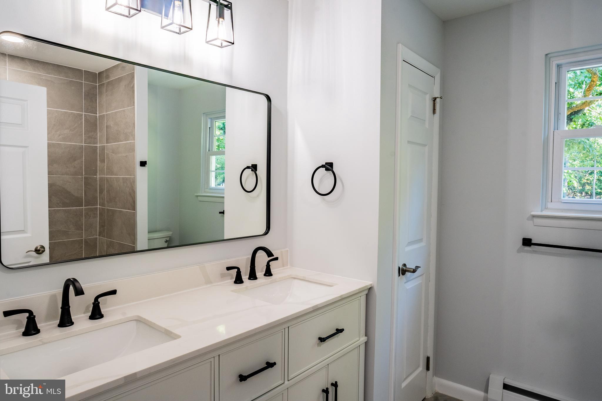 1428 Valley Forge Road Norristown, PA 19403 - Photo 20 of 24 a bathroom with a sink and mirror