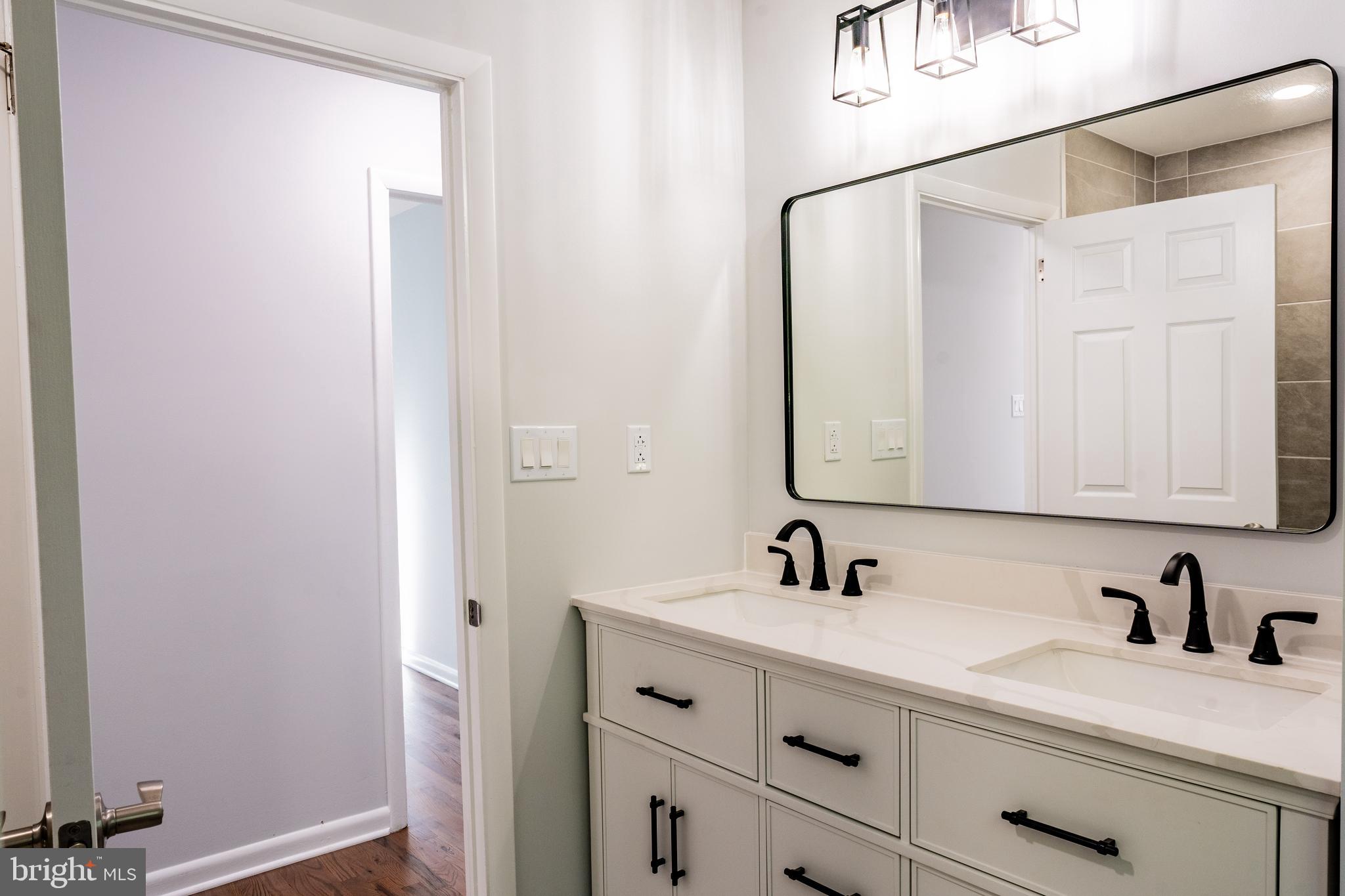 1428 Valley Forge Road Norristown, PA 19403 - Photo 21 of 24 a bathroom with a sink and a mirror