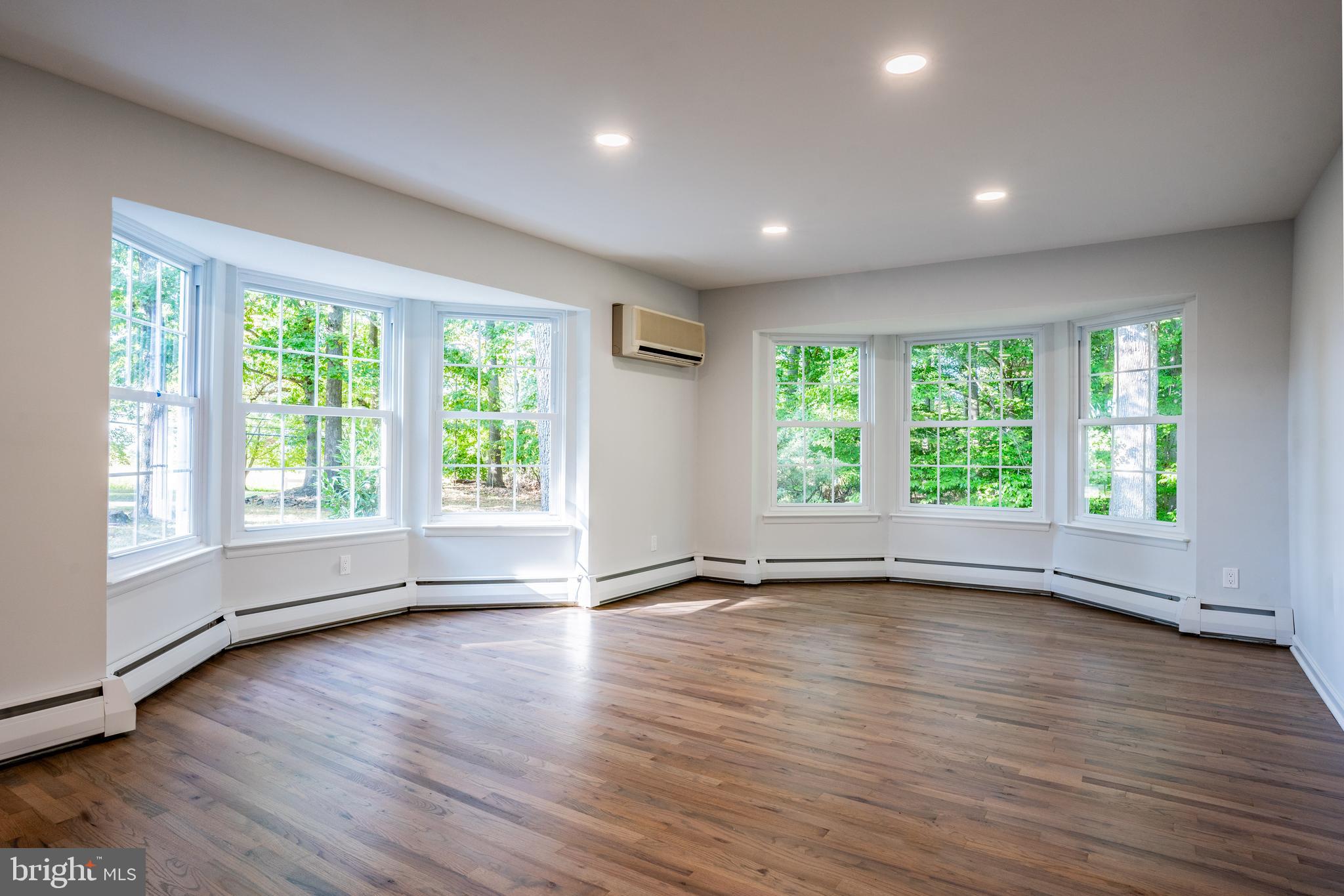 1428 Valley Forge Road Norristown, PA 19403 - Photo 5 of 24 a view of empty room with wooden floor and fan