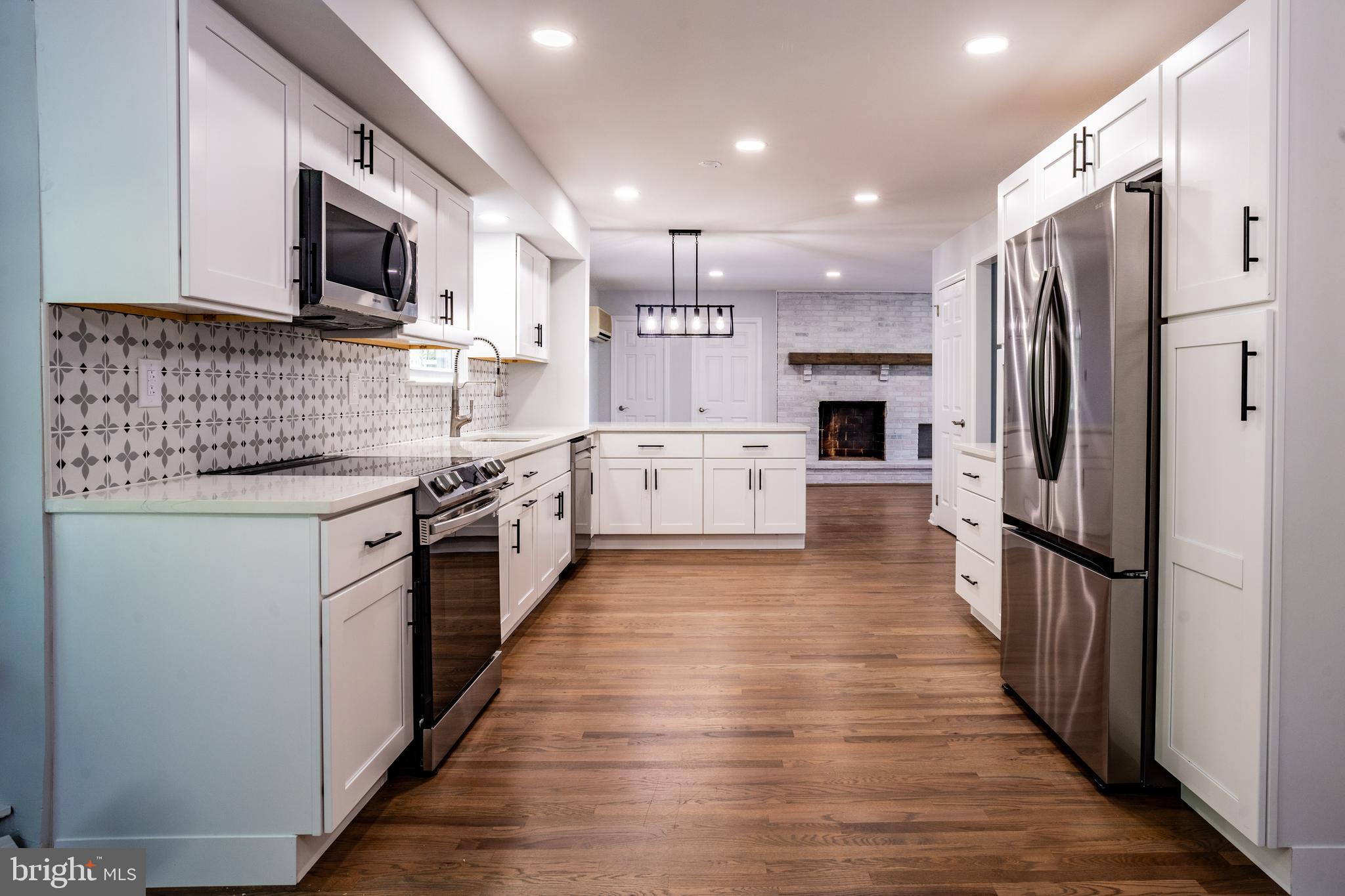 1428 Valley Forge Road Norristown, PA 19403 - Photo 9 of 24 a kitchen with stainless steel appliances granite countertop a refrigerator a stove top oven a sink and dishwasher