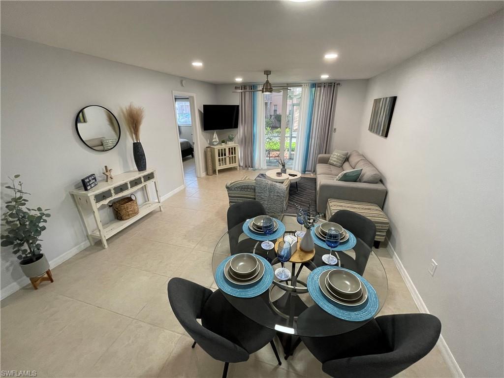 170 Turtle Lake Court, Unit 103 Naples, FL 34105 - Photo 1 of 37 Dining room with light tile patterned floors and recessed lighting