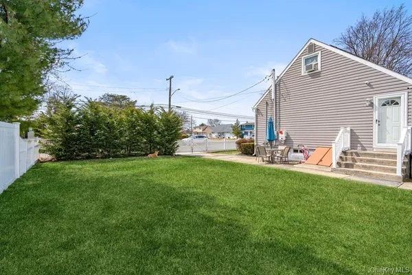 a view of a backyard with plants and a garden
