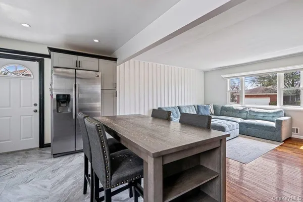 a view of a kitchen and dining room
