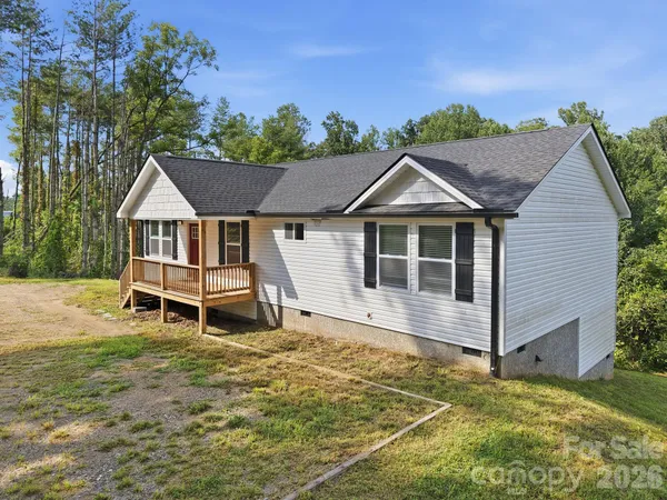 a house with trees in the background