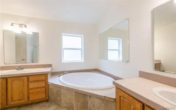 a bathroom with a sink a vanity and a mirror
