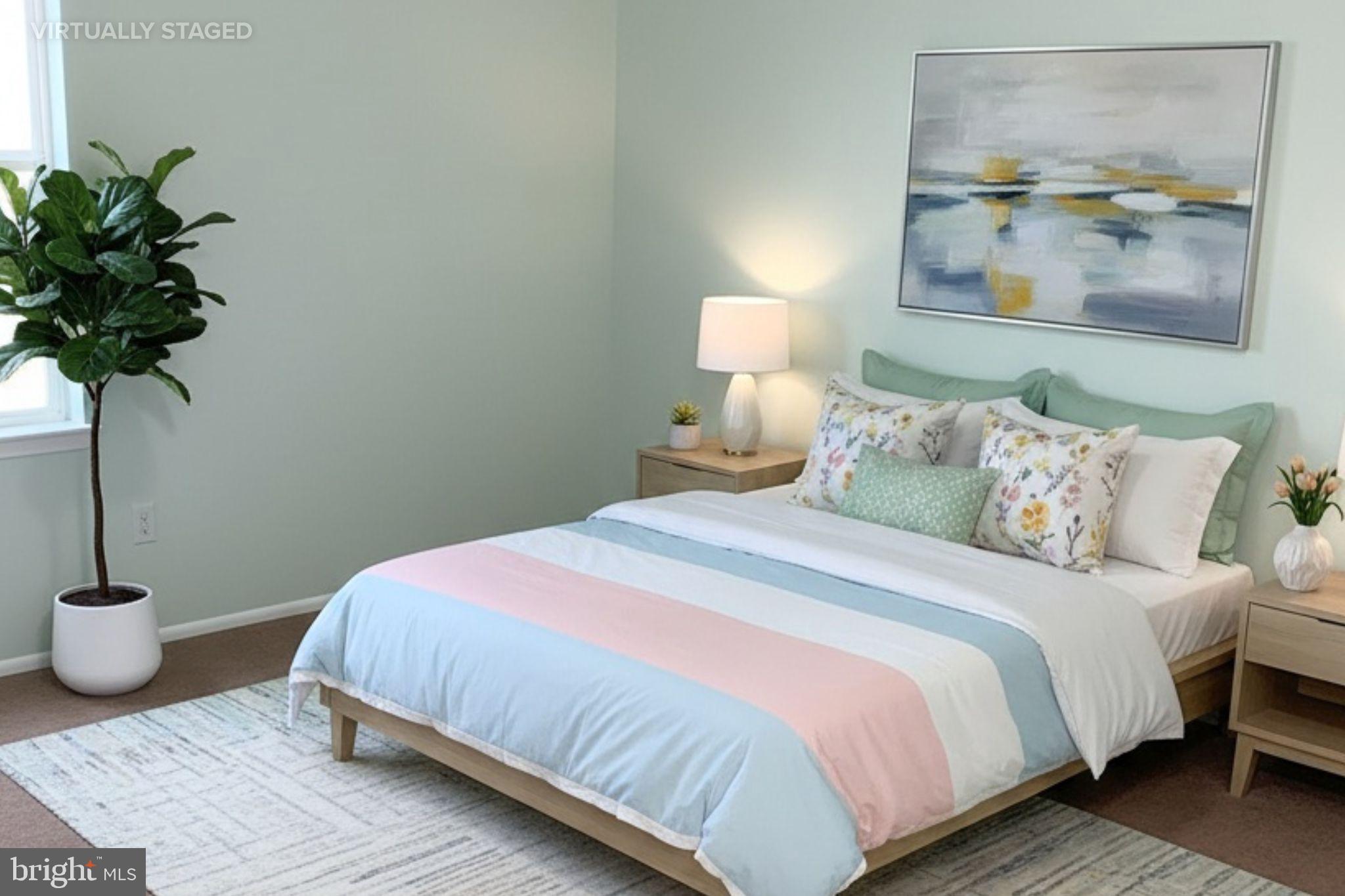 2727 Rhawn Street Philadelphia, PA 19152 - Photo 6 of 10 a bedroom with bed and a potted plant