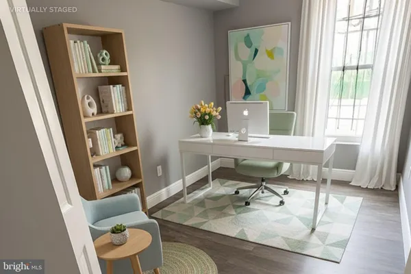 a workspace with furniture and window
