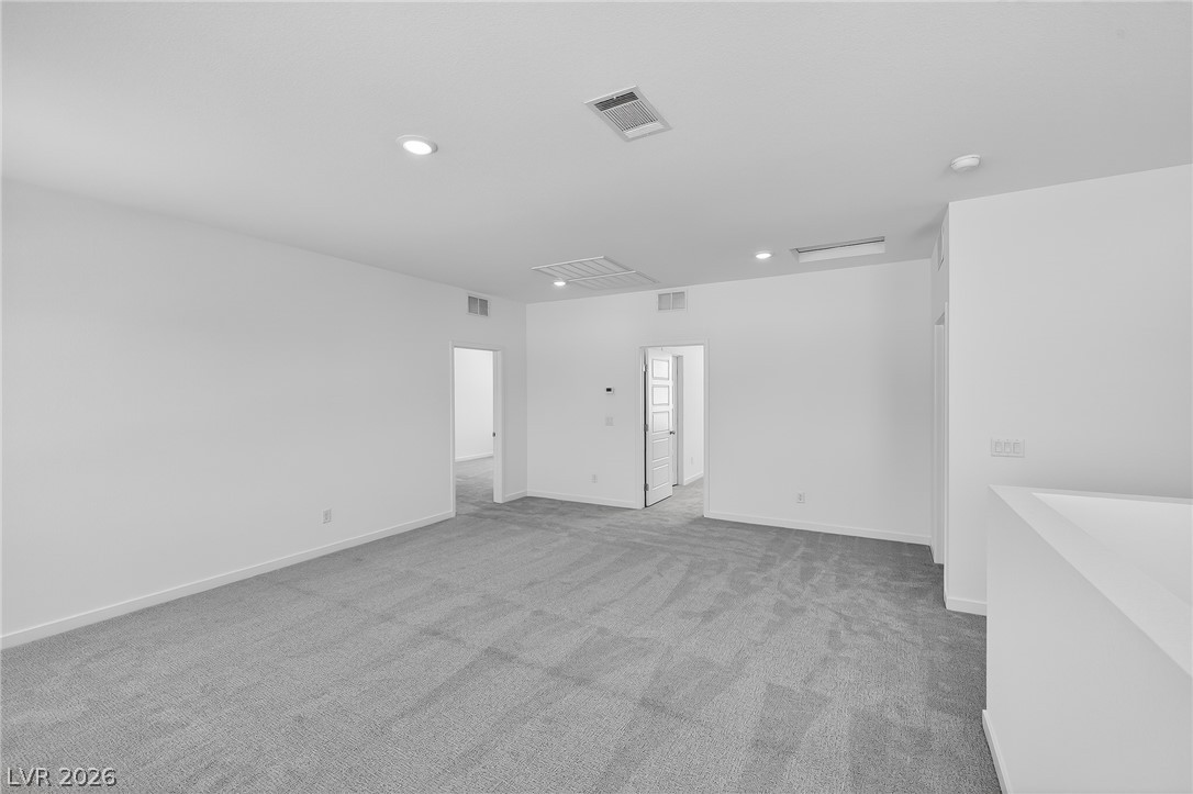347 Sam Way Mesquite, NV 89027 - Photo 32 of 32 An airy secondary living area offers plush carpeting and generous open space for flexible use.