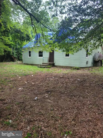 a house view with a backyard space