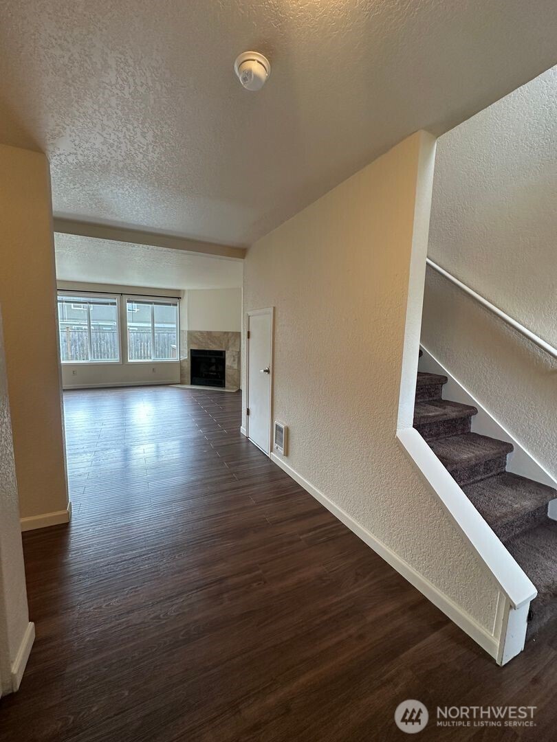 5100 81st Place Southwest, Unit B Mukilteo, WA 98275 - Photo 2 of 12 a view of a room with wooden floor