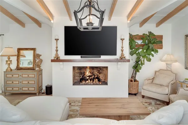 a kitchen with stainless steel appliances a stove a sink and a microwave