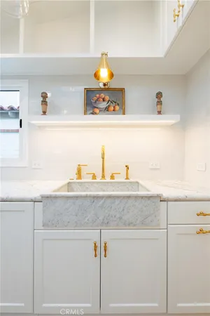a bathroom with a sink vanity and mirror
