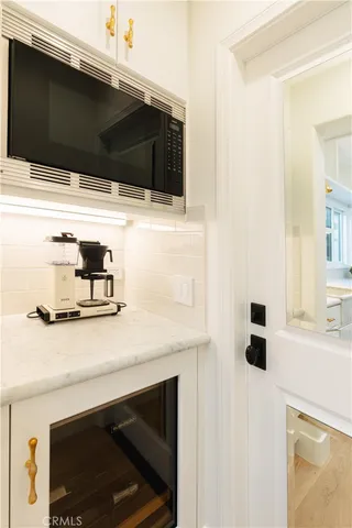 a bathroom with a sink vanity and mirror