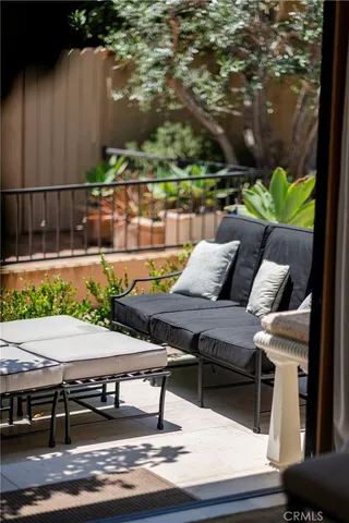 a view of a kitchen with cabinets and stainless steel appliances