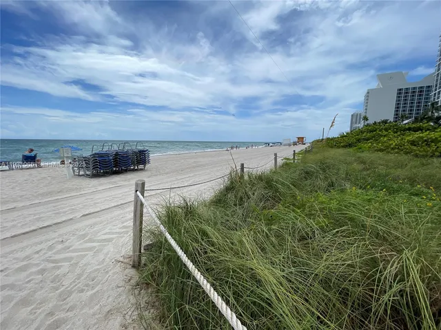 a kitchen with stainless steel appliances a sink and cabinets