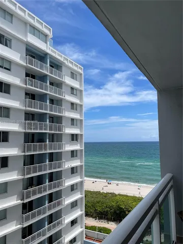a view of a balcony with an ocean view