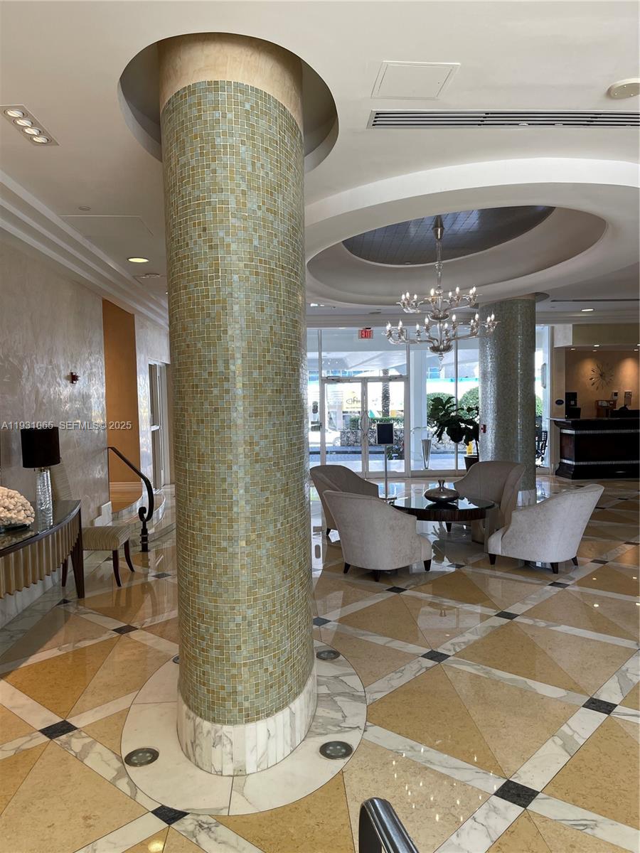 6917 Collins Avenue, Unit 1008 Miami Beach, FL 33141 - Photo 24 of 64 a living room filled with furniture