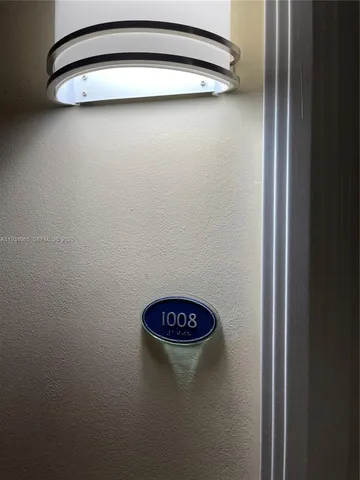 a living room with furniture a wooden floor and a dining table