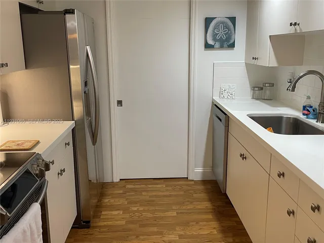 a bedroom with a bed and a night stand