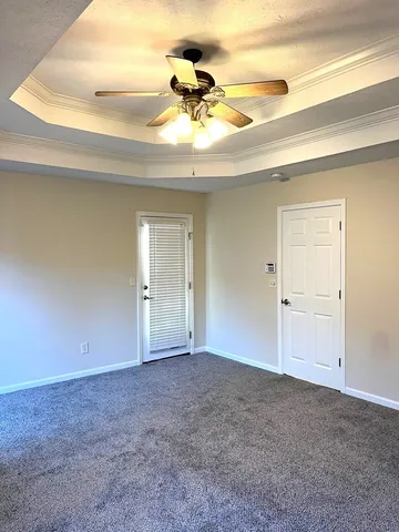 a view of a room with a ceiling fan
