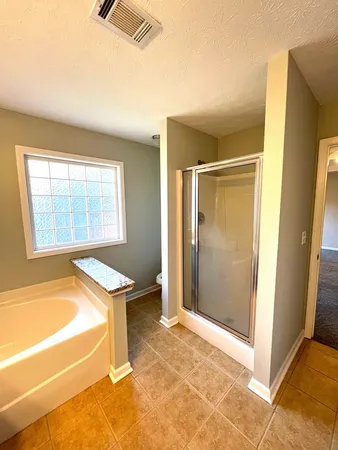 a view of a kitchen with a sink and a window