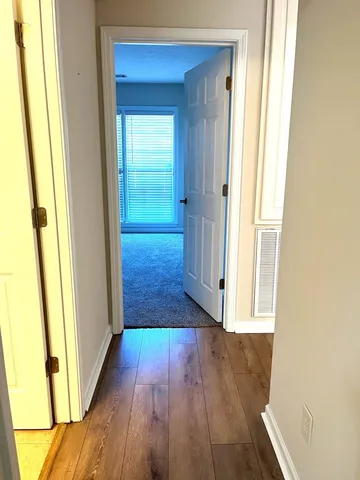a view of front door with wooden floor