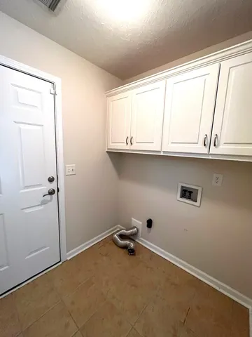 a view of backyard with green space