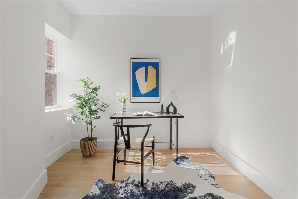 65 Pleasant Street, Unit 3 Brookline, MA 02446 - Photo 13 of 19 a view of entryway with table and chair