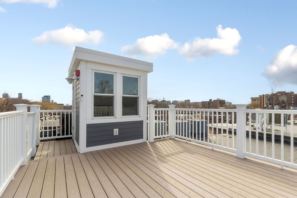 65 Pleasant Street, Unit 3 Brookline, MA 02446 - Photo 17 of 19 a view of a house with a deck