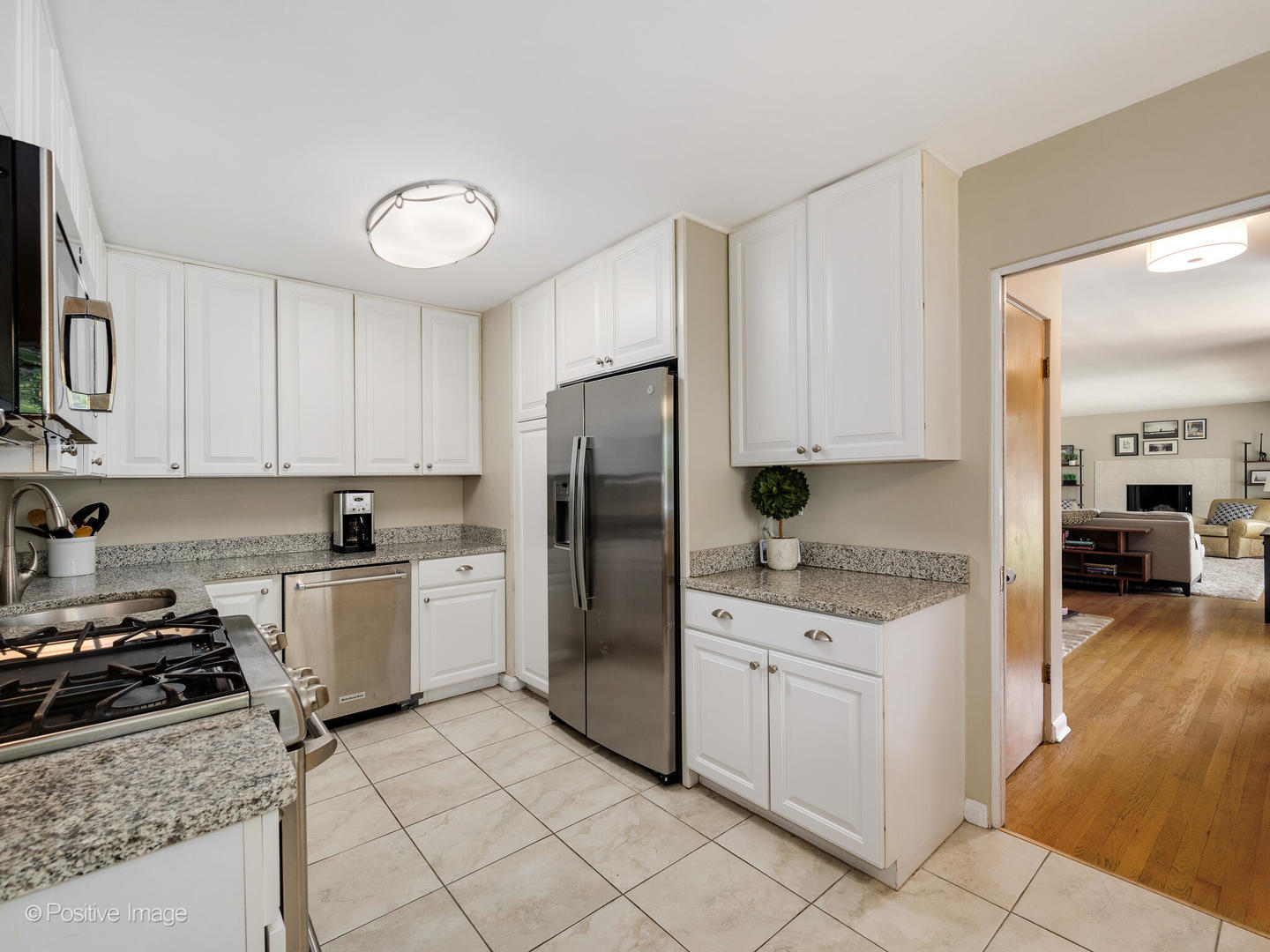 801 Windsor Road Glenview, IL 60025 - Photo 8 of 29 a kitchen with a stove a sink and a refrigerator