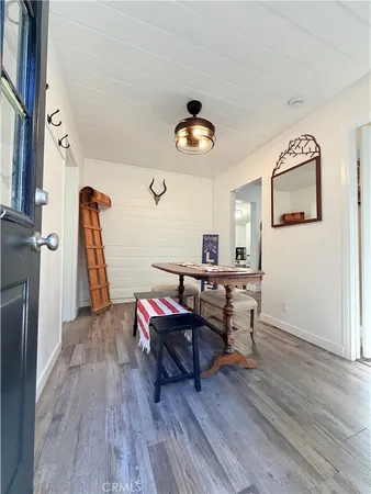 a living room with furniture a rug and a window