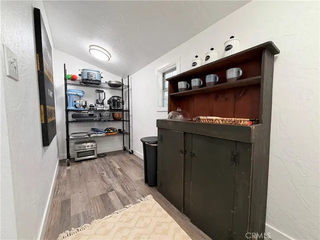 a bedroom with a bed window and couch