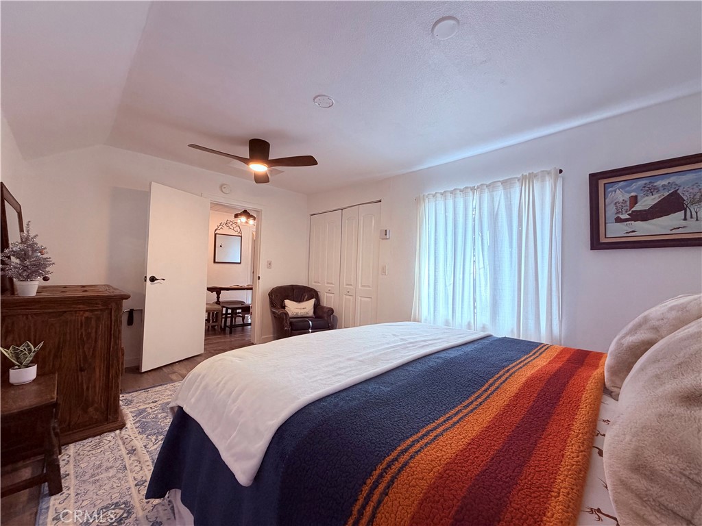 926 Kuffel Canyon Road Lake Arrowhead, CA 92385 - Photo 34 of 52 a bedroom with a bed and a dresser