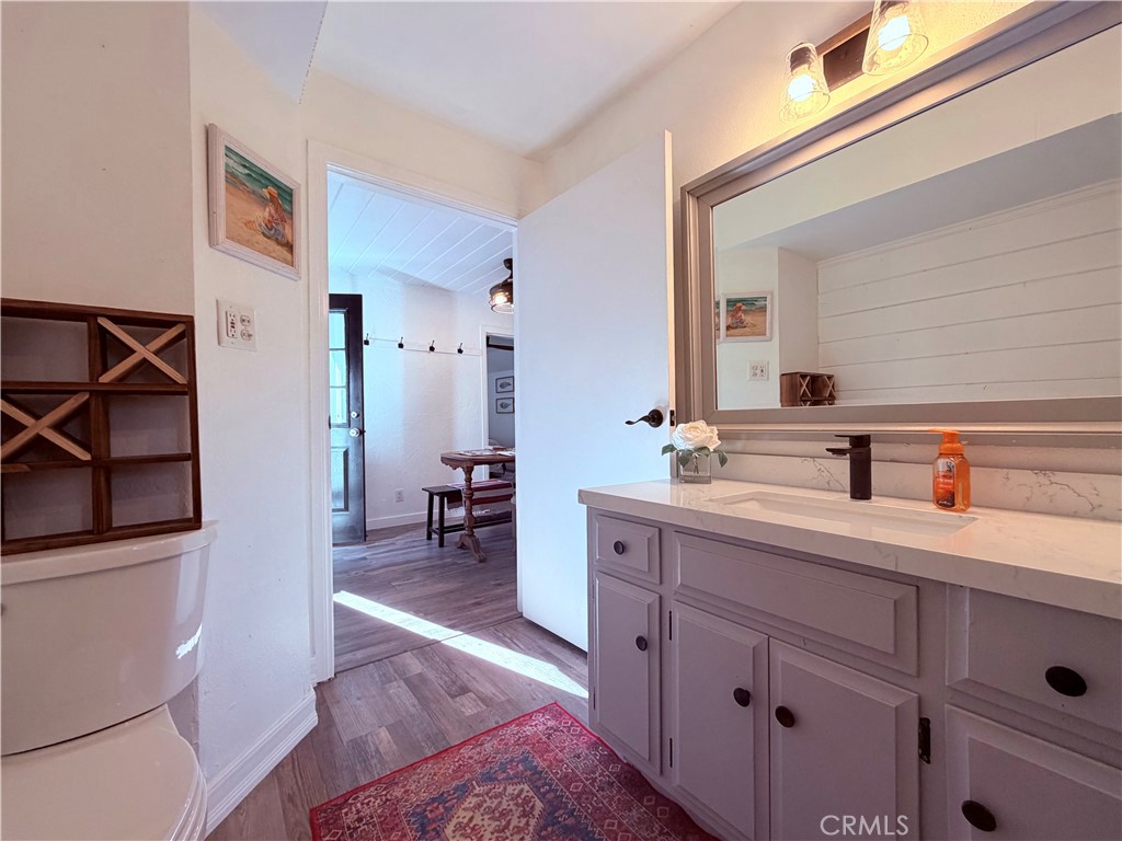 926 Kuffel Canyon Road Lake Arrowhead, CA 92385 - Photo 37 of 52 a spacious bathroom with a sink a toilet and a mirror