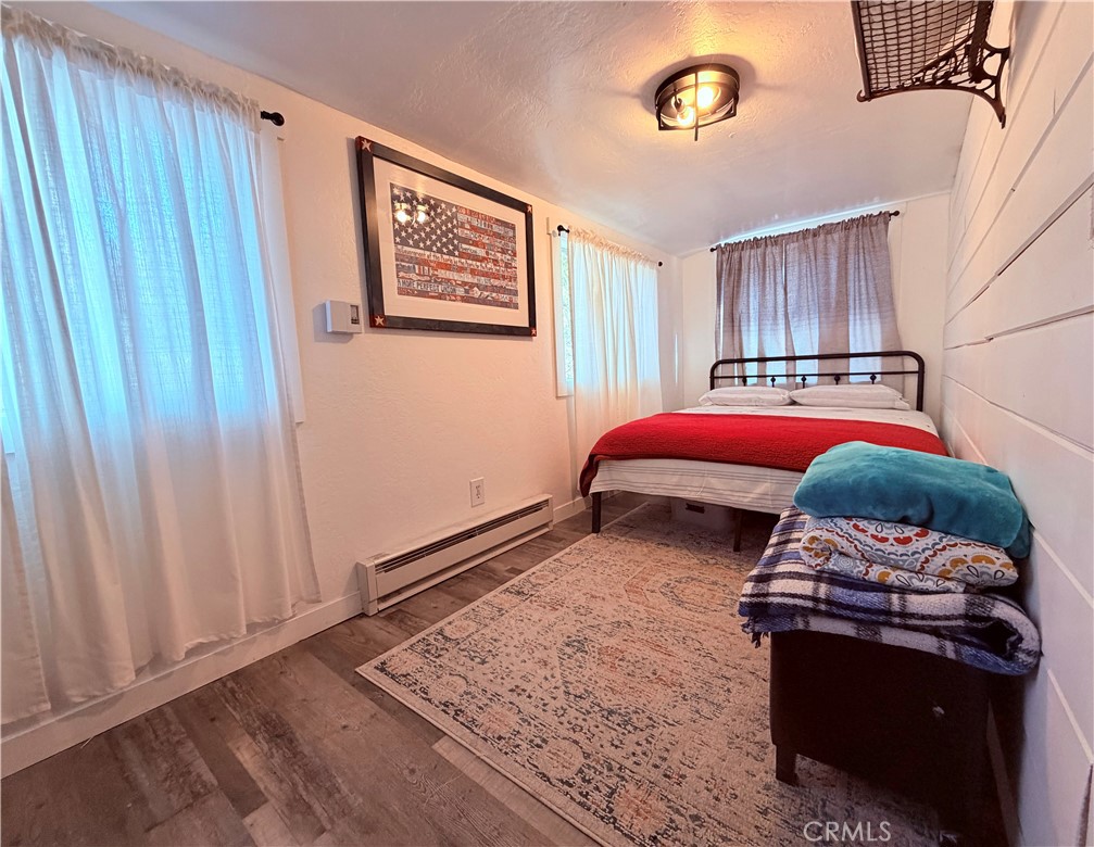 926 Kuffel Canyon Road Lake Arrowhead, CA 92385 - Photo 38 of 52 a bedroom with bed and a window