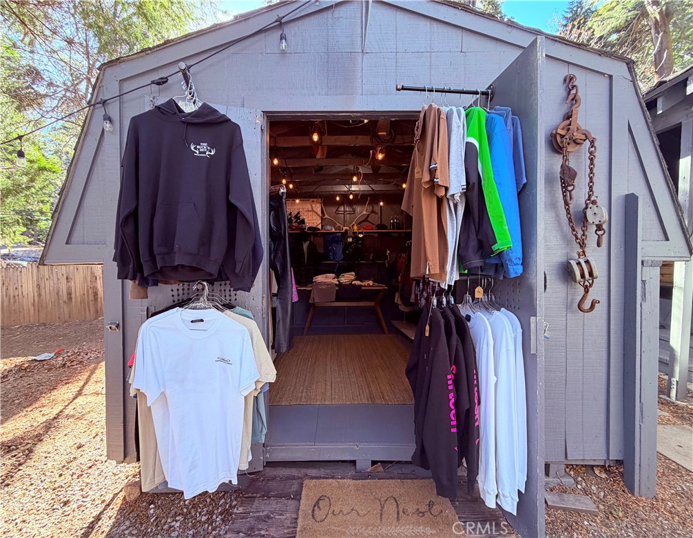926 Kuffel Canyon Road Lake Arrowhead, CA 92385 - Photo 41 of 52 a view of walk in closet with clothes and shoes