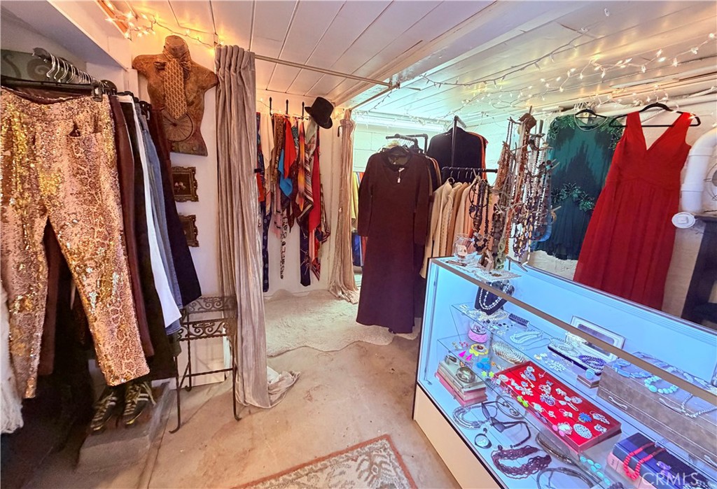 926 Kuffel Canyon Road Lake Arrowhead, CA 92385 - Photo 49 of 52 a view of walk in closet with clothes and shoes