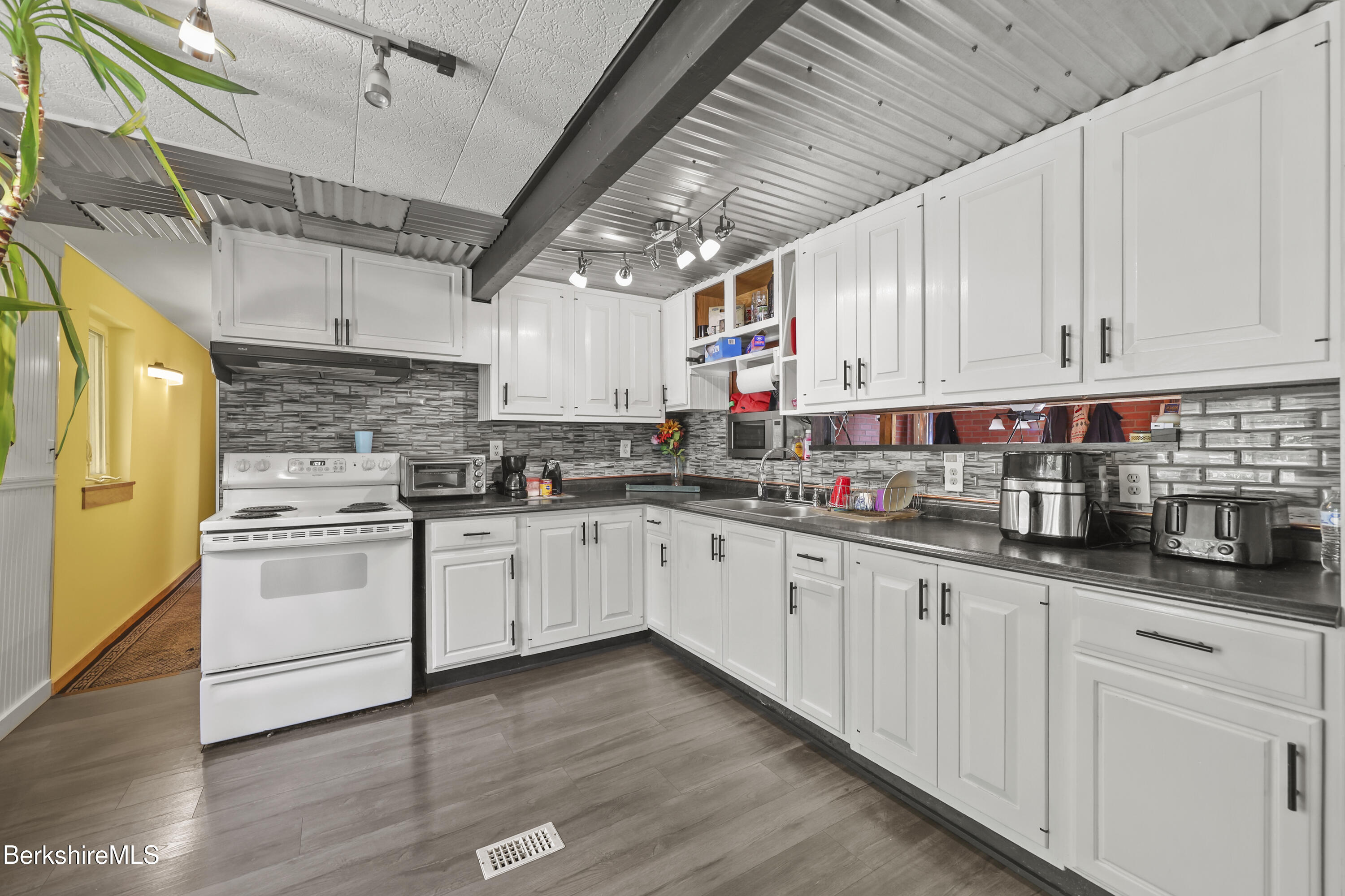 192 Curran Road Cheshire, MA 01225 - Photo 7 of 50 a kitchen with granite countertop white cabinets and white appliances