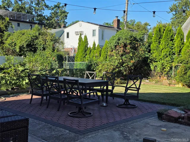 a view of a chairs and tables in the patio