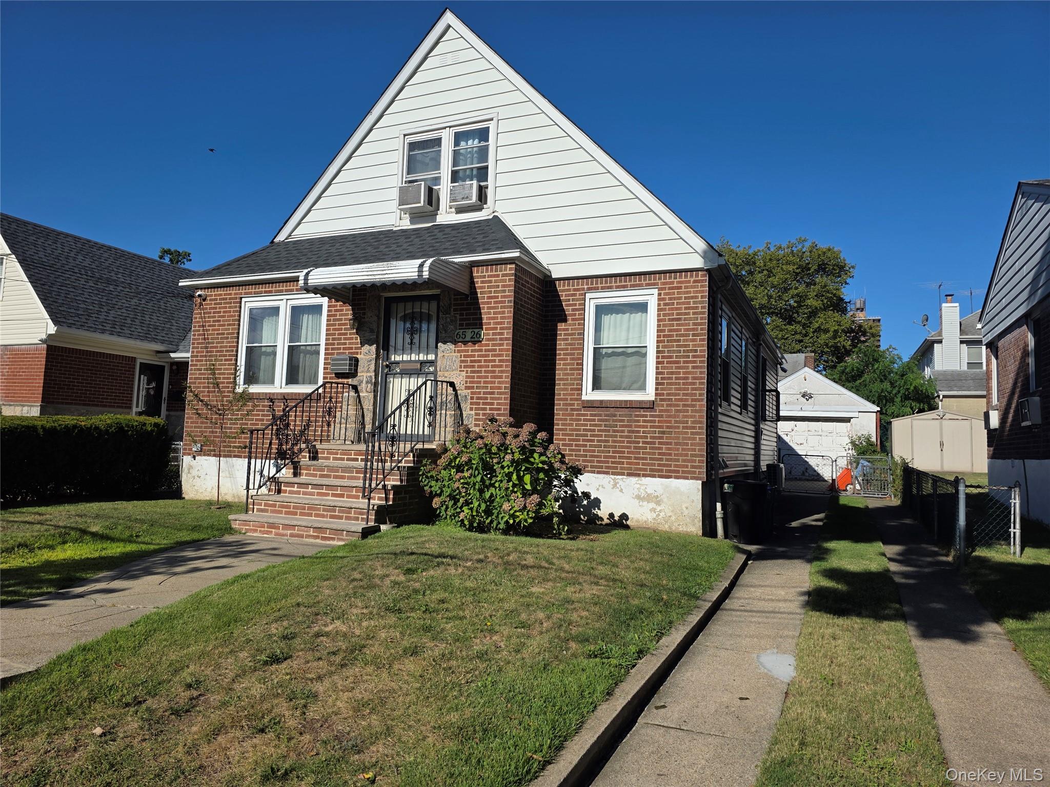 65-26 167th Street Queens, NY 11365 - Photo 2 of 15 Bungalow-style home featuring brick siding