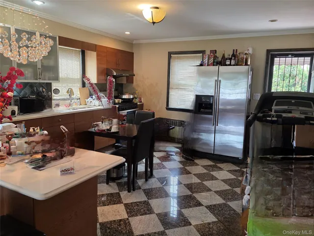 a kitchen with a sink appliances and a refrigerator
