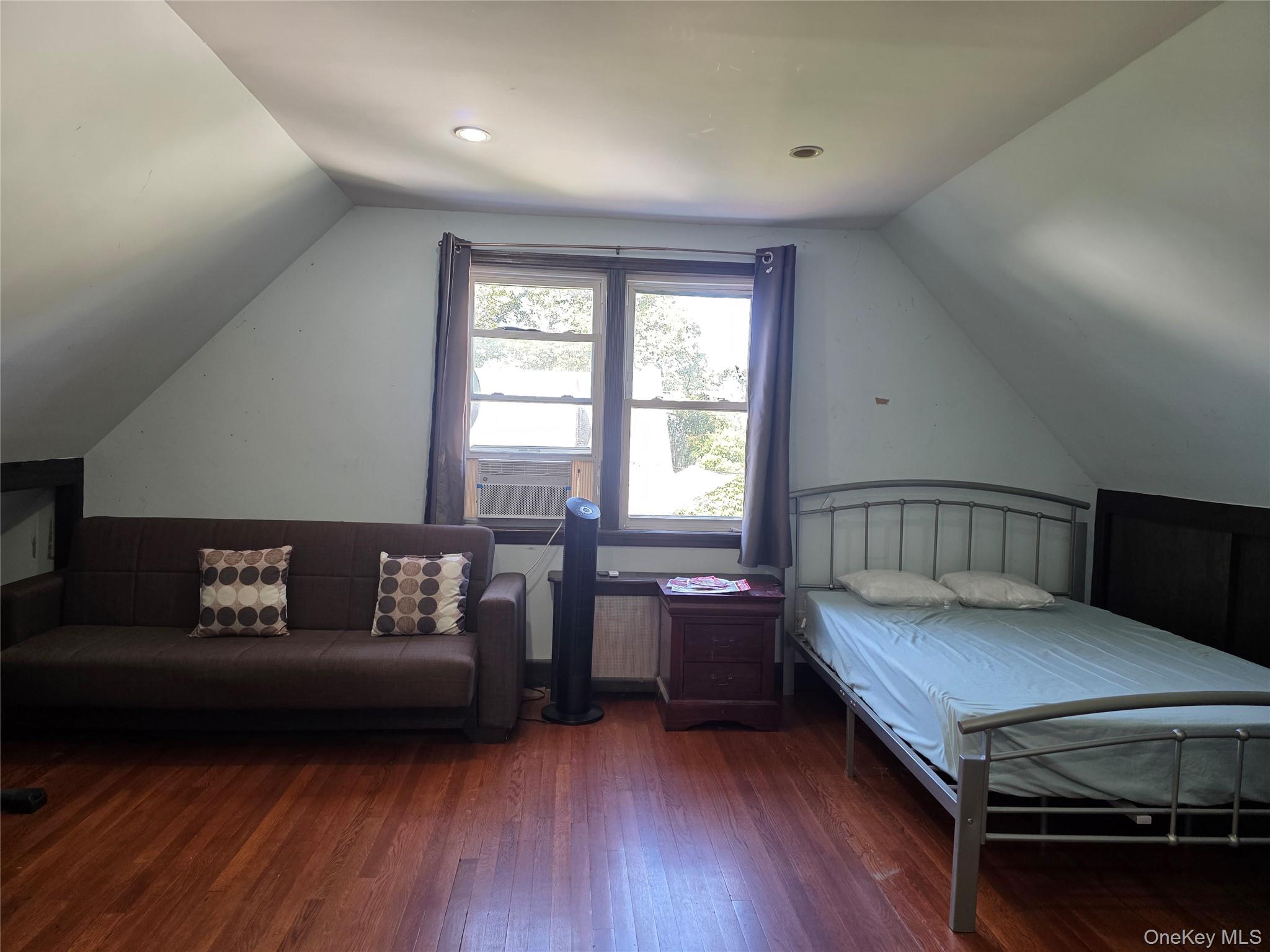 65-26 167th Street Queens, NY 11365 - Photo 10 of 15 Bedroom with lofted ceiling and hardwood / wood-style floors