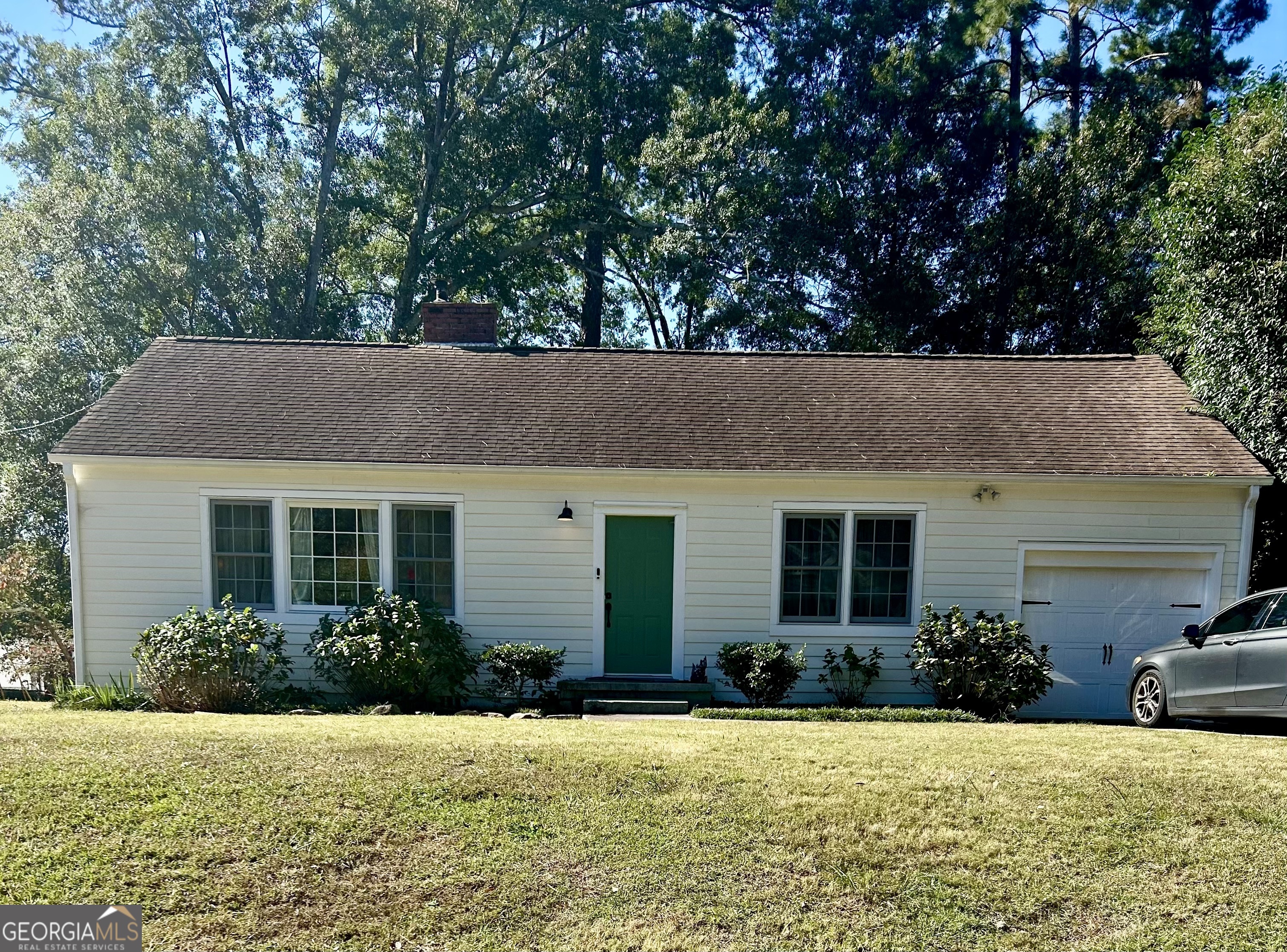 155 Windsor Court Athens, GA 30606 - Photo 1 of 14 a house that has a tree in front of it