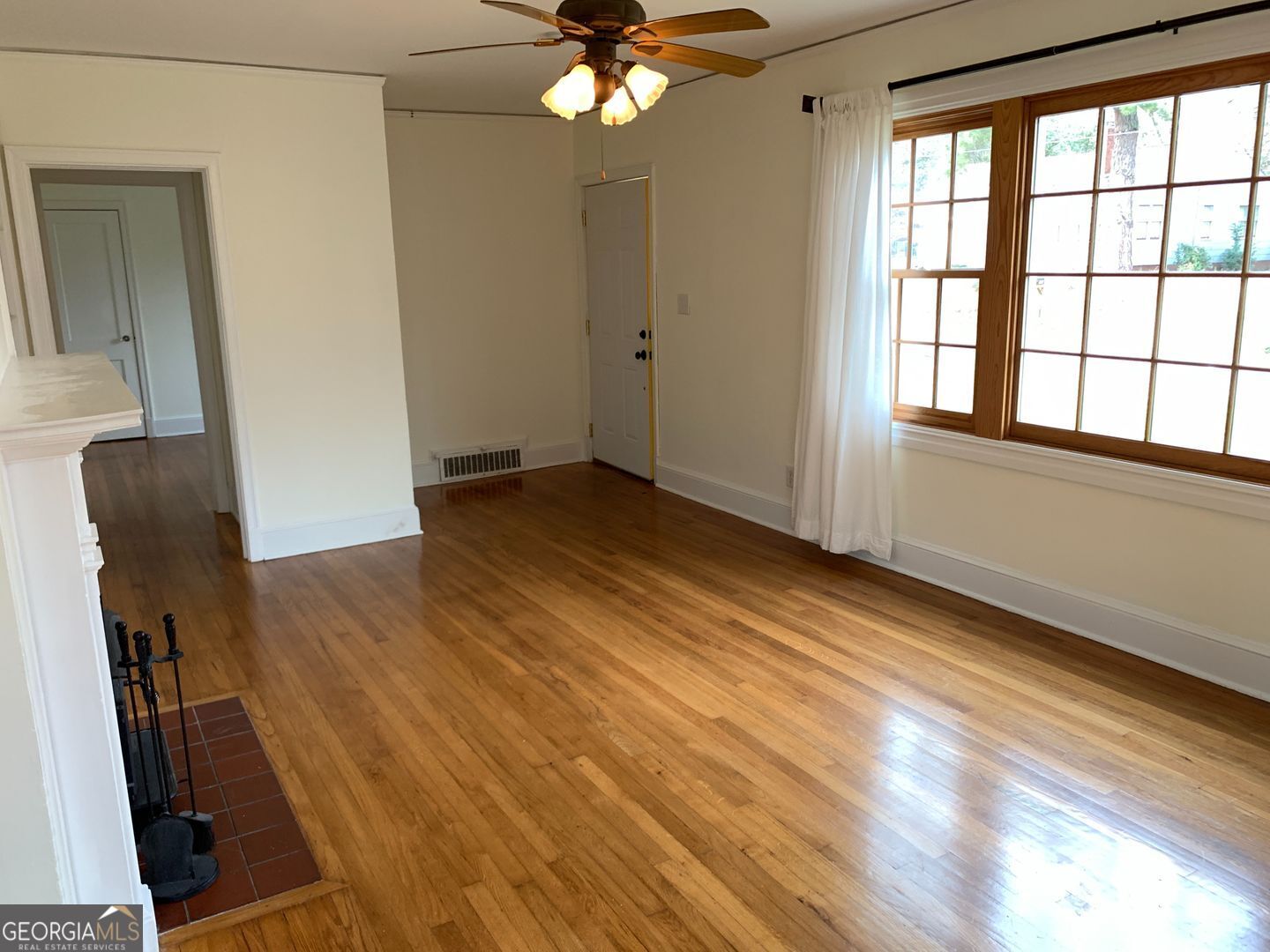 155 Windsor Court Athens, GA 30606 - Photo 5 of 14 wooden floor in an empty room with a window