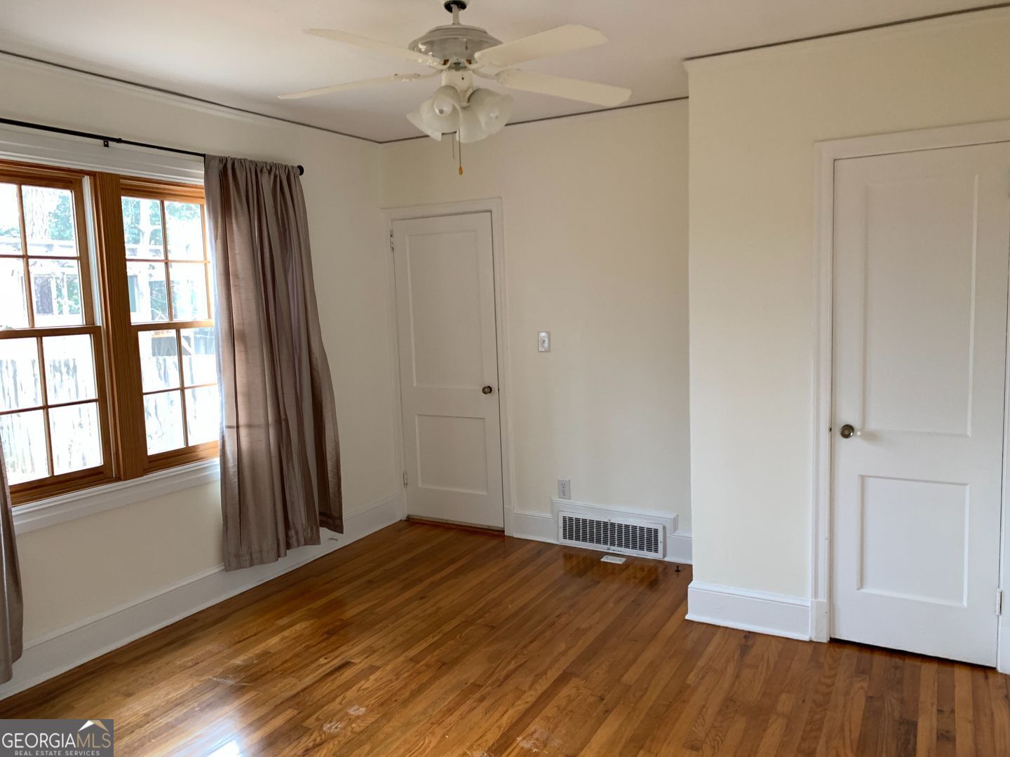 155 Windsor Court Athens, GA 30606 - Photo 7 of 14 wooden floor in an empty room with a window